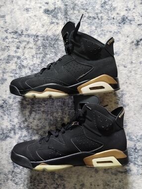 Nike Air Jordan Black and Gold High-Top Sneakers